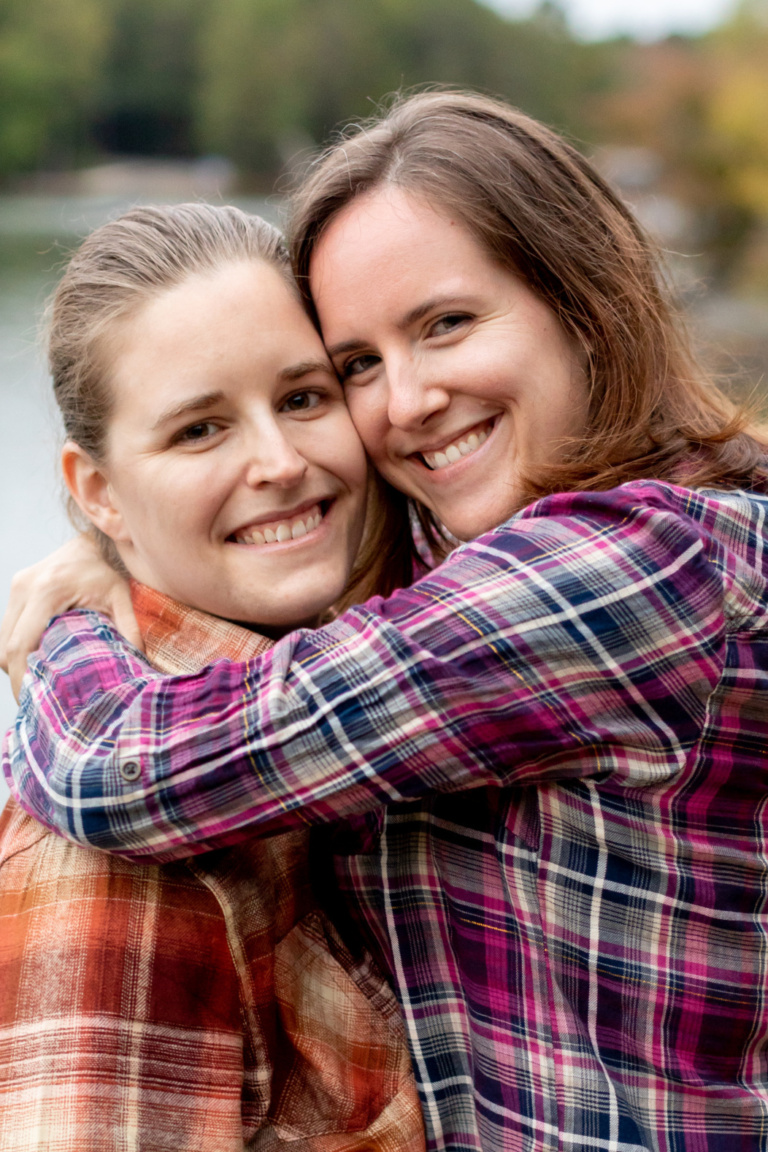 Woman holding another woman in arms